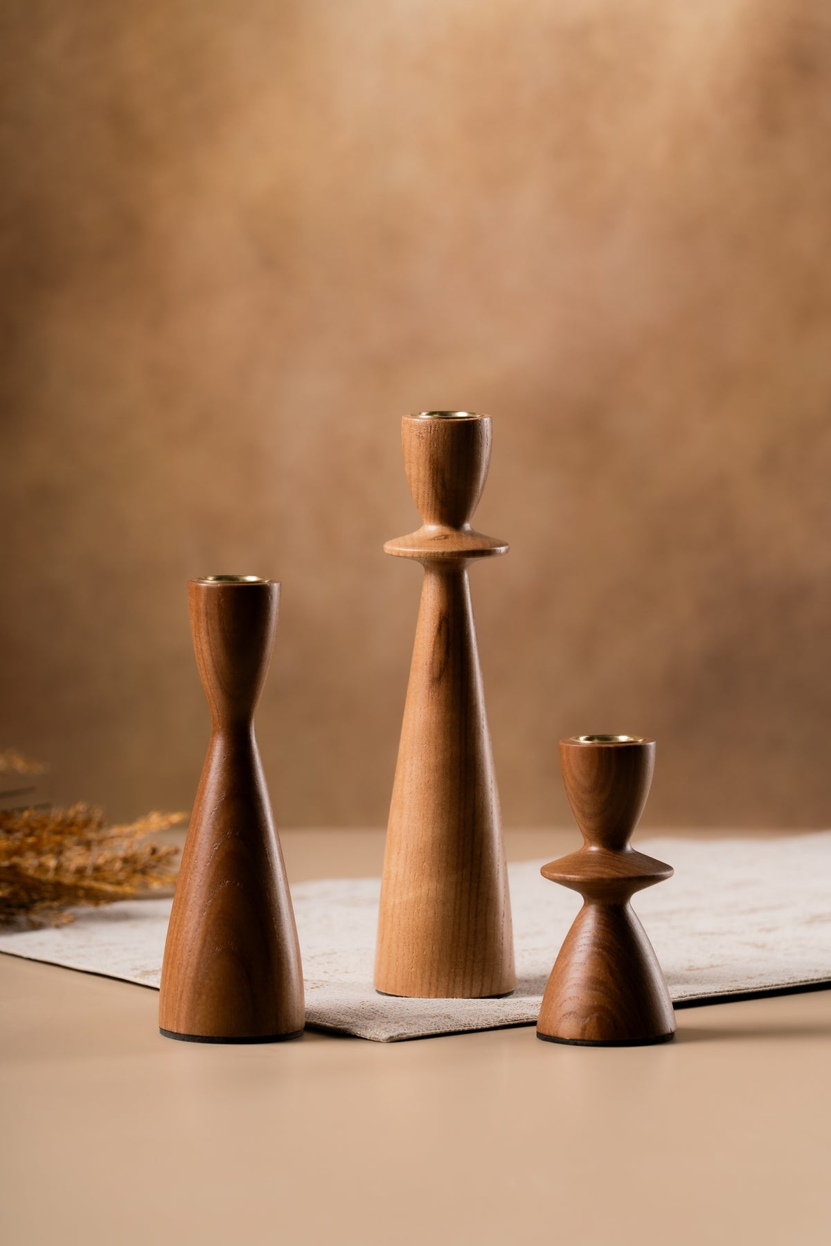 Metal candle cups on the wooden holders