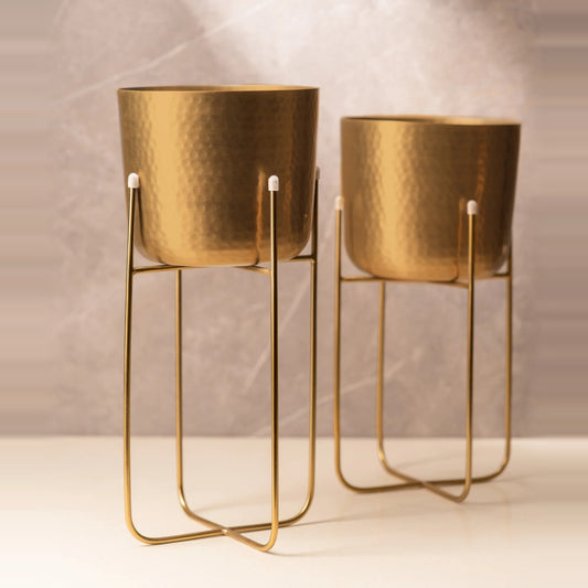 Set of two hammered gold planters on wire stands