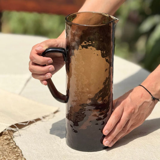 Amber tinted glass water jug with textured surface – Popyuli India