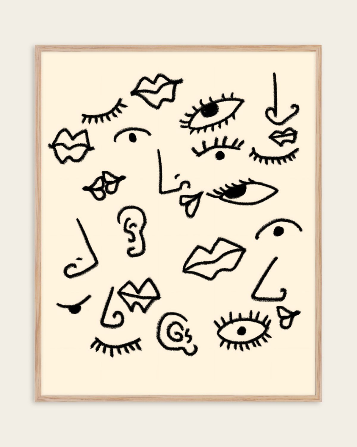 Senses black line art print of eyes, lips, noses and ears on a cream background