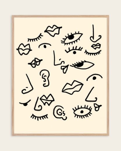 Senses black line art print of eyes, lips, noses and ears on a cream background