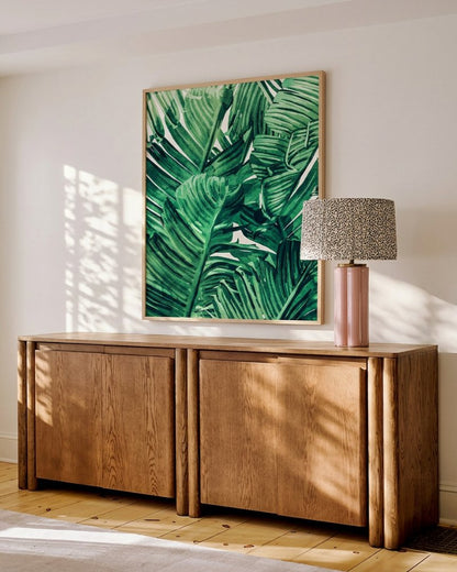 Tropical State of Mind green watercolor banana leaf botanical art print styled in a room
