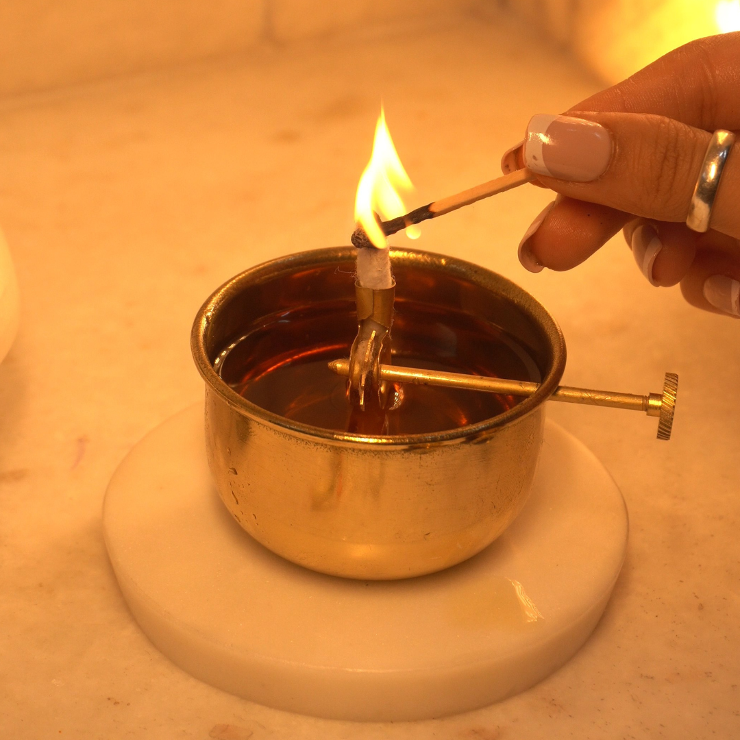 Lighting the Akhand Jyot diya
