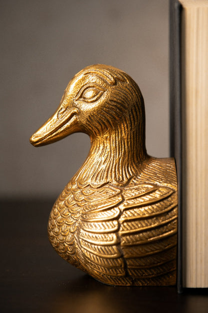 Close-up of carved feathers on the duck bookend