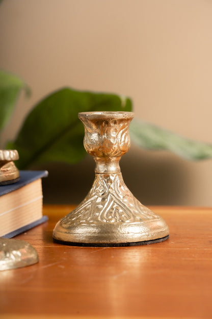 Colonial candle holders styled with books and greenery