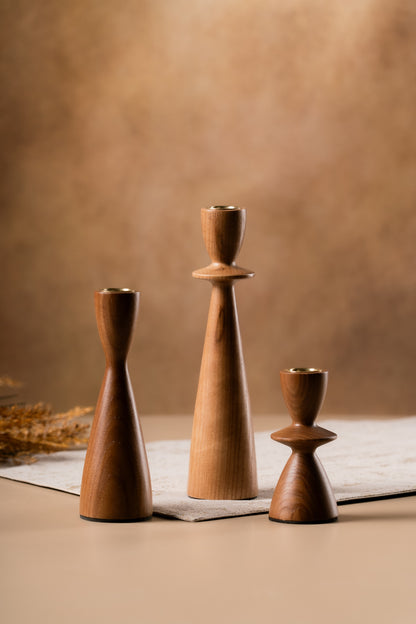 Metal candle cups on the wooden holders