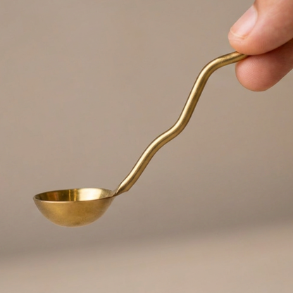 Curved brass ghee spoon
