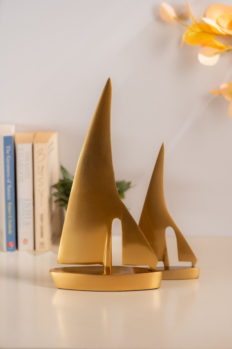 Golden sail boats styled with books