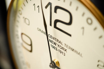 Close-up of the cream wall clock dial