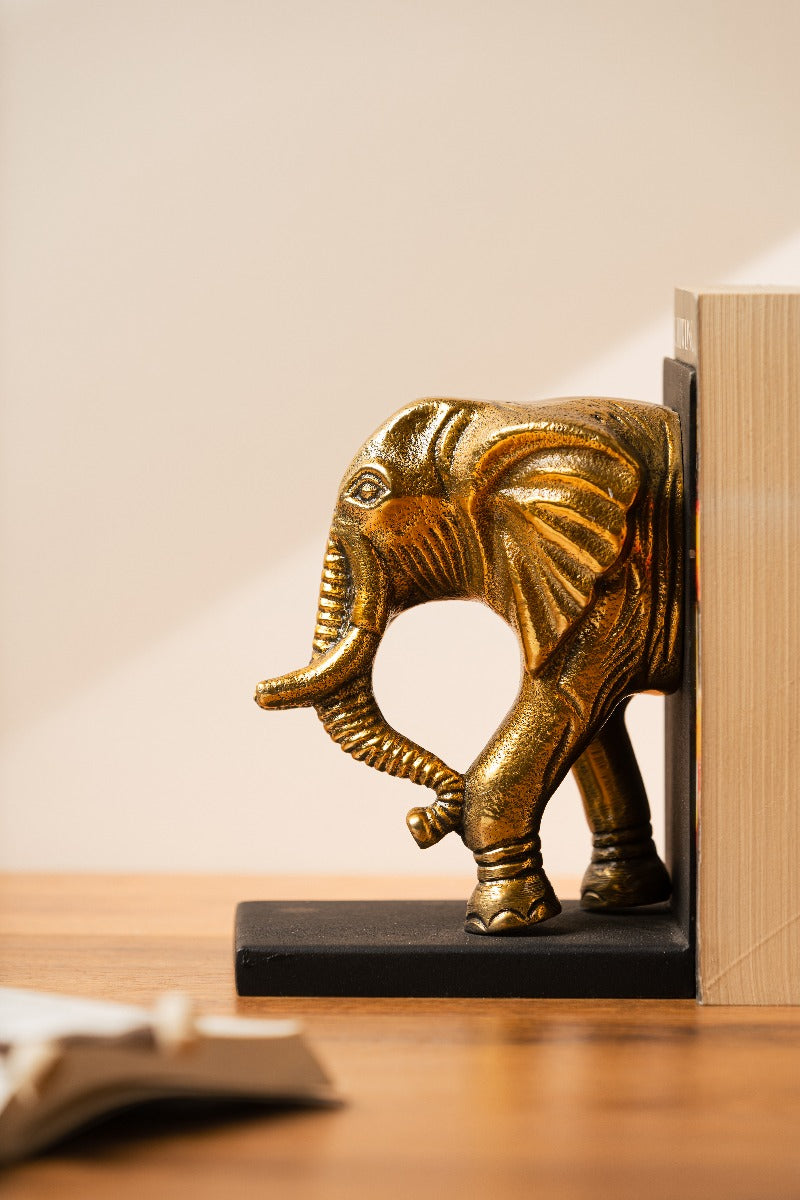 Carved detailing on the gold elephant bookend