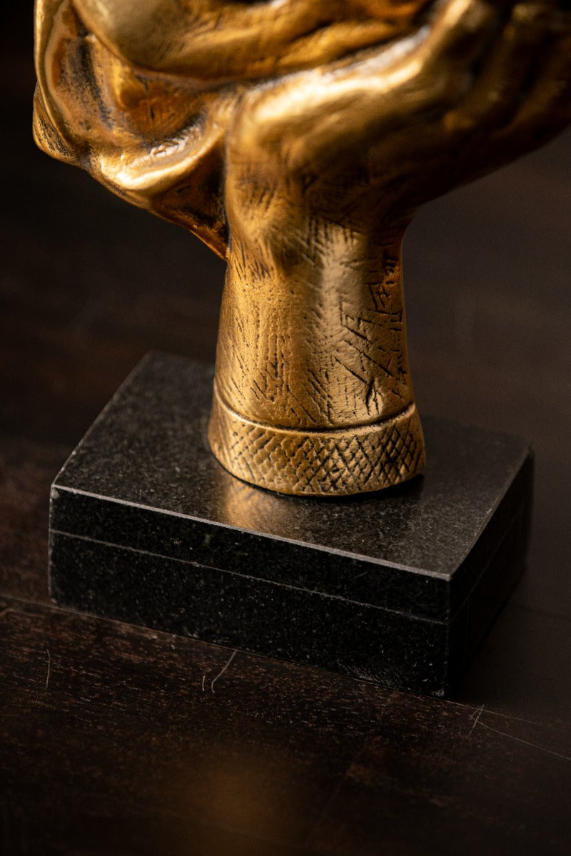Detail of the hand and marble base