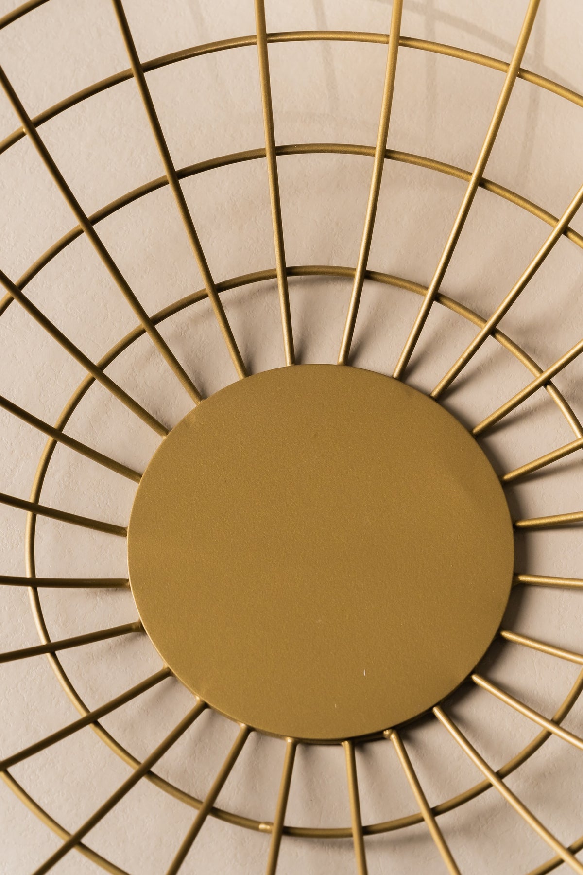 Top view of the gold wire basket and its solid round base