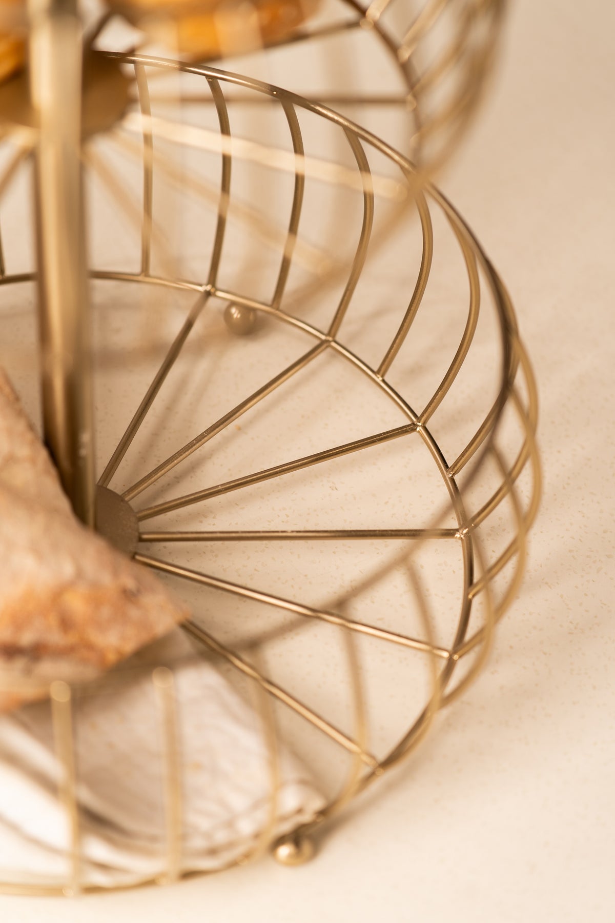 Detail of the gold wire weave on the lower tier