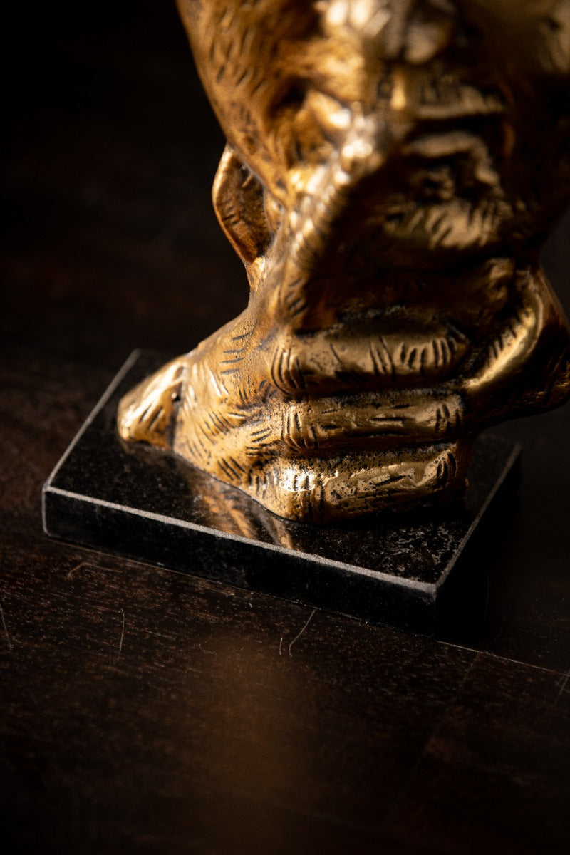 Close-up of carved detailing and marble base