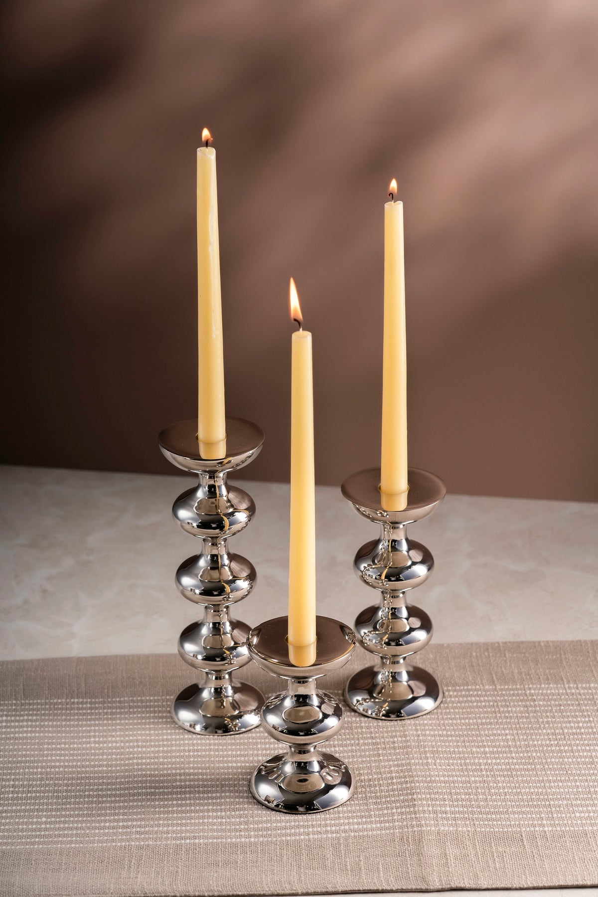 Polished stacked silver candle holders