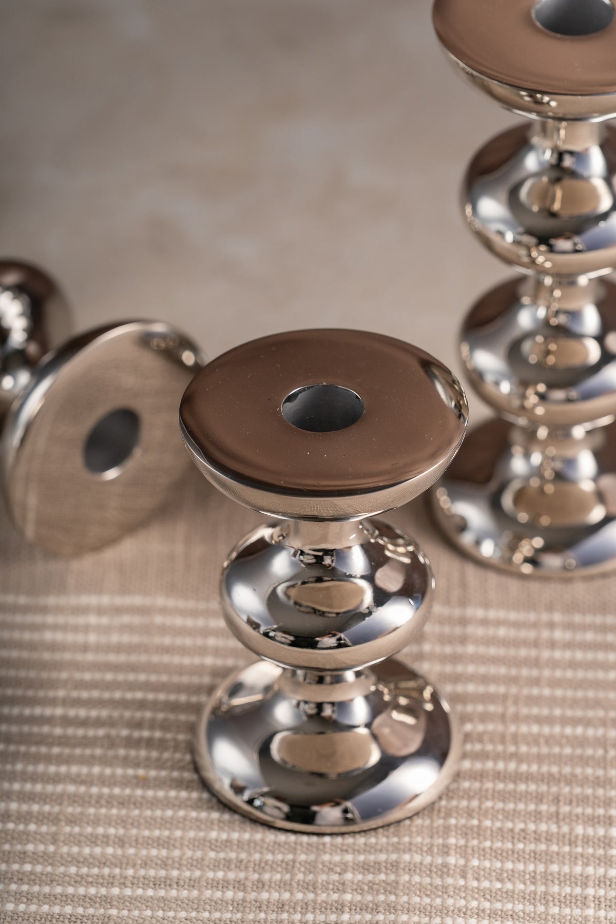 Close-up of a tiered silver candle holder