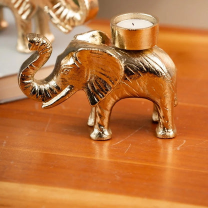 Gold elephant tealight holder with a lit tealight