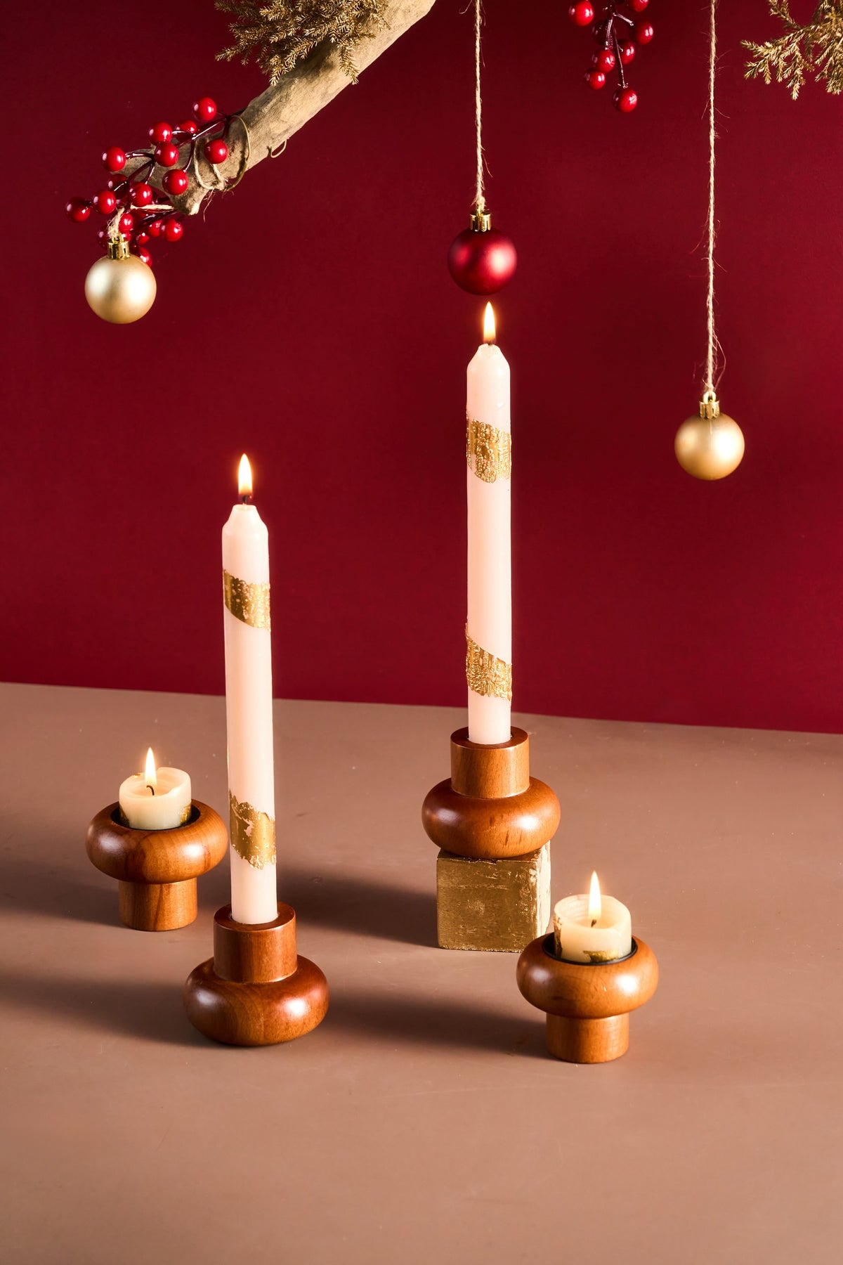 Set of four two-way wooden candle holders