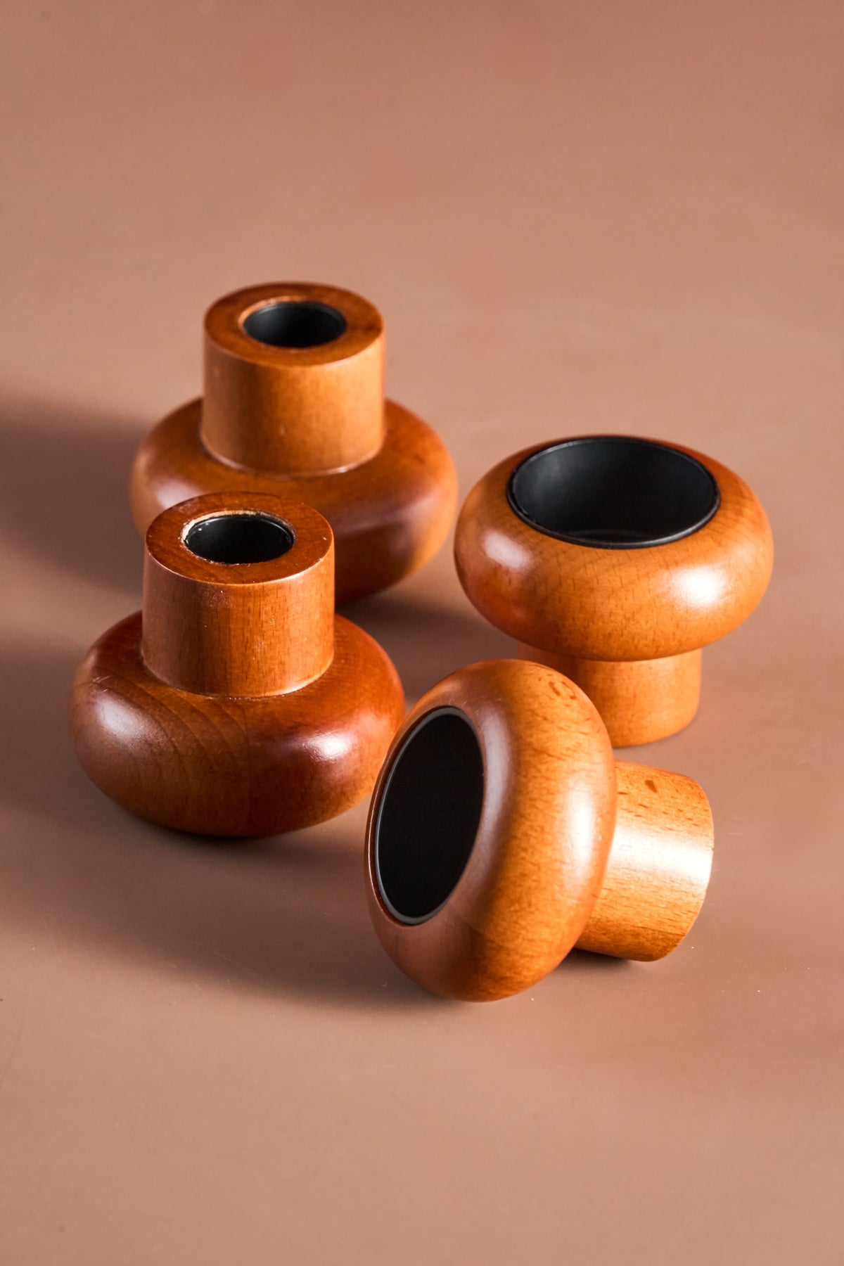 Lighting a tealight in a wooden candle holder